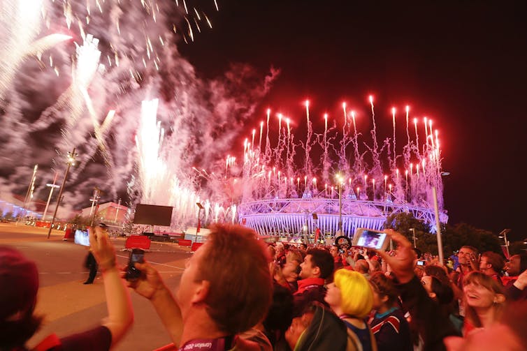 Crowds watching the London 2012 opening ceremony.