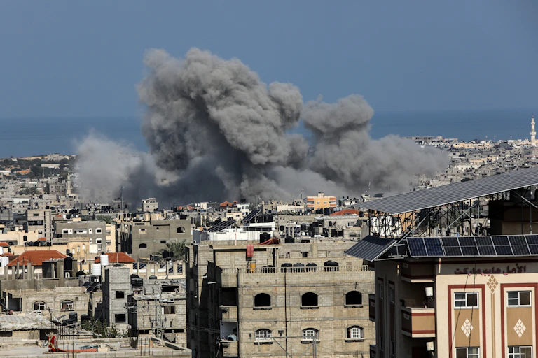 An airstrike hitting a densely populated city in the Gaza Strip.