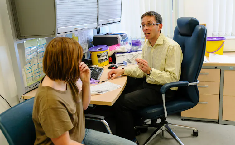 GP talks to a patient