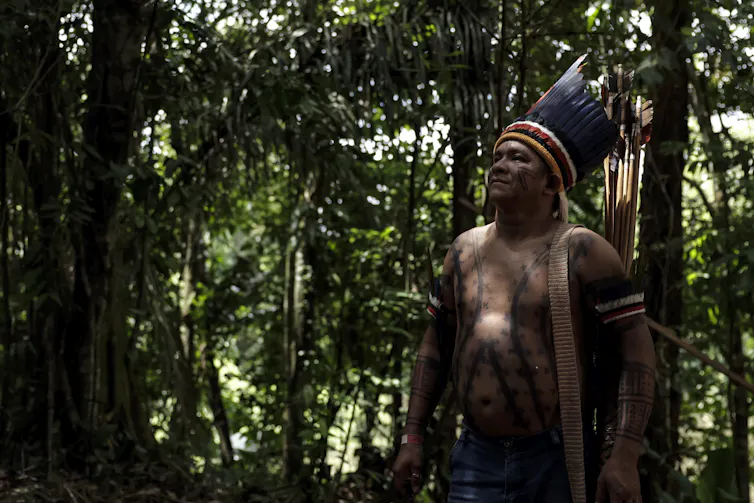 indigenous man in forest in Brazil