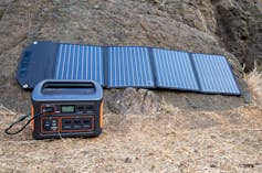 A solar generator - four fold up small solar panels connected to a battery