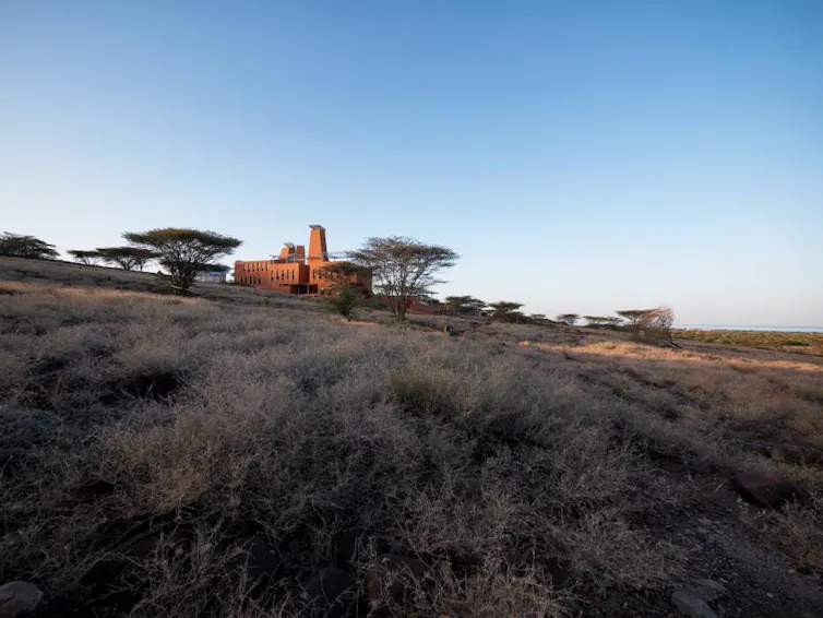 African landscape, small building in background that looks like termite mound
