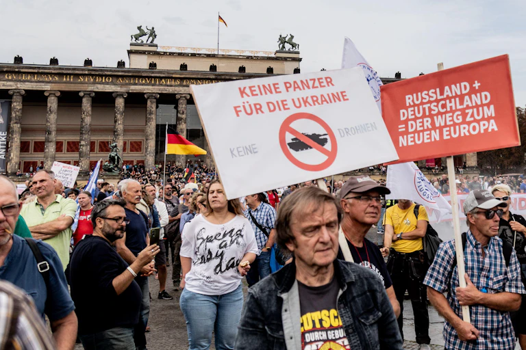 German protesters with placards calling for closer co-operation with Russia.