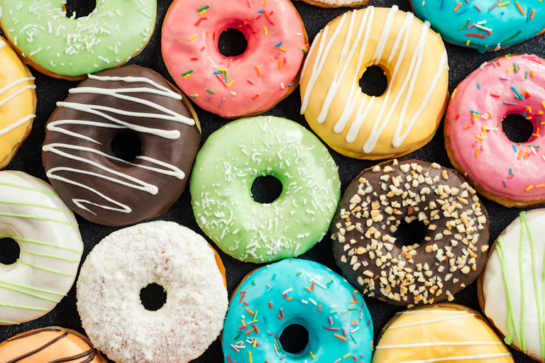 Donuts glazed in different colours.
