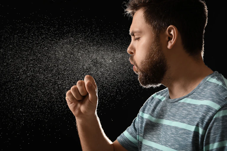 A man sneezing.