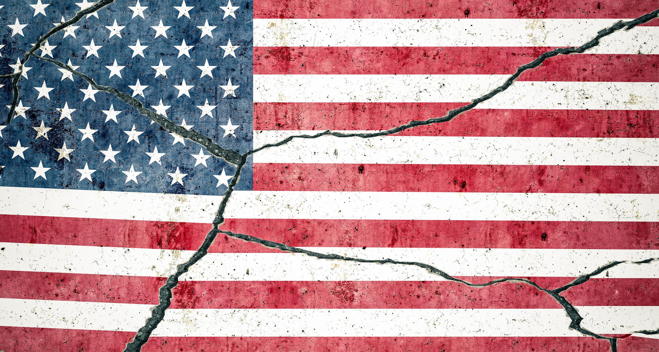 An American flag shows cracks down the center.