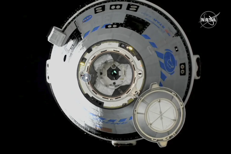 A conical metal craft floating through space.