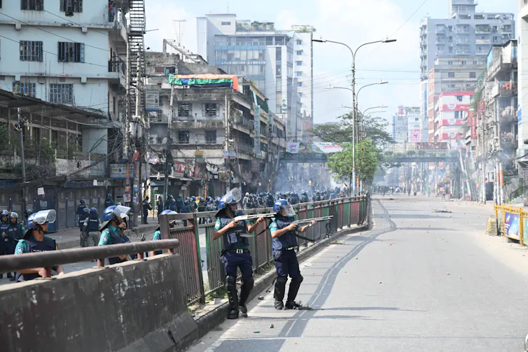 Police clash with students during a protest in Dhaka.
