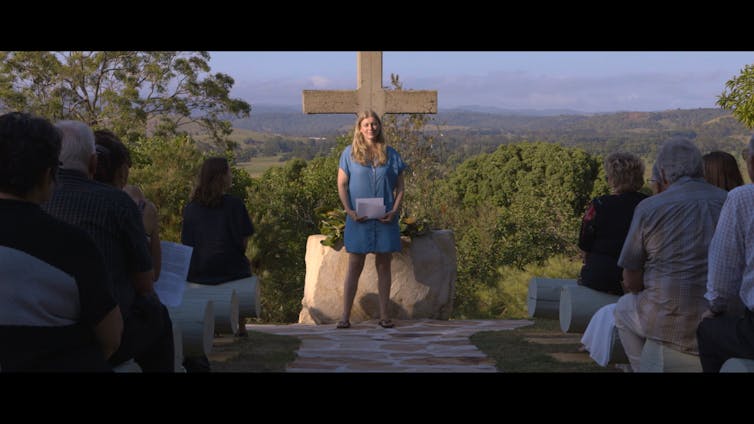 Kathryn Joy leads a memorial service.