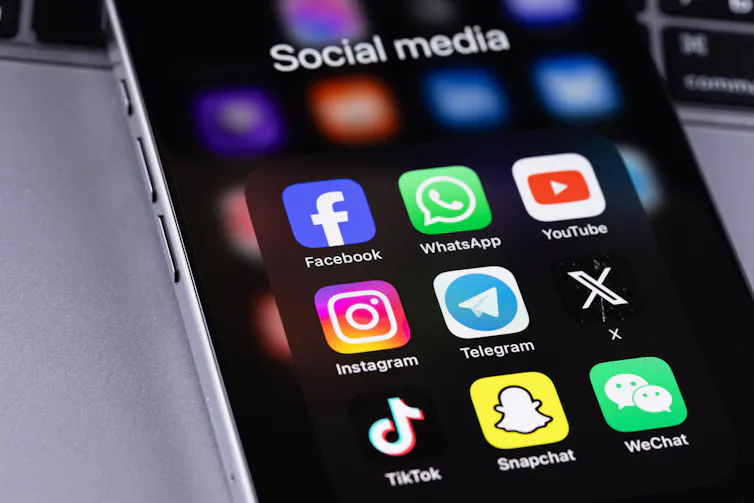 Smartphone with social media app icons.