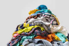 pile of colourful clothes, white background