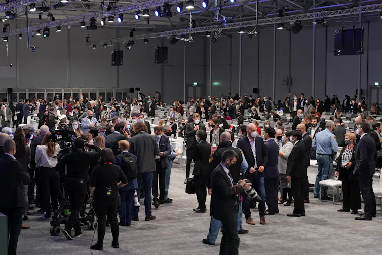 climate talks and delegates in room