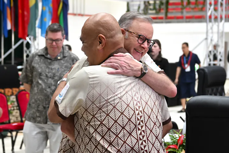 two men hugging