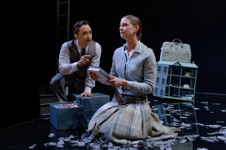 Production image: a woman holds a book