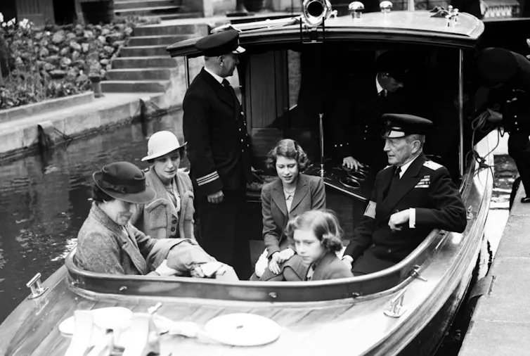 Black and white historic photo, they're in a boat.