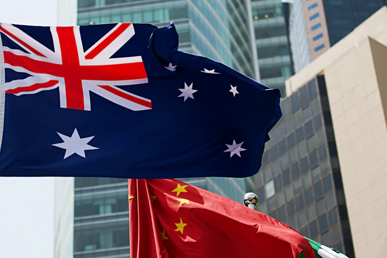 Australian and Chinese flags blowing in the breeze