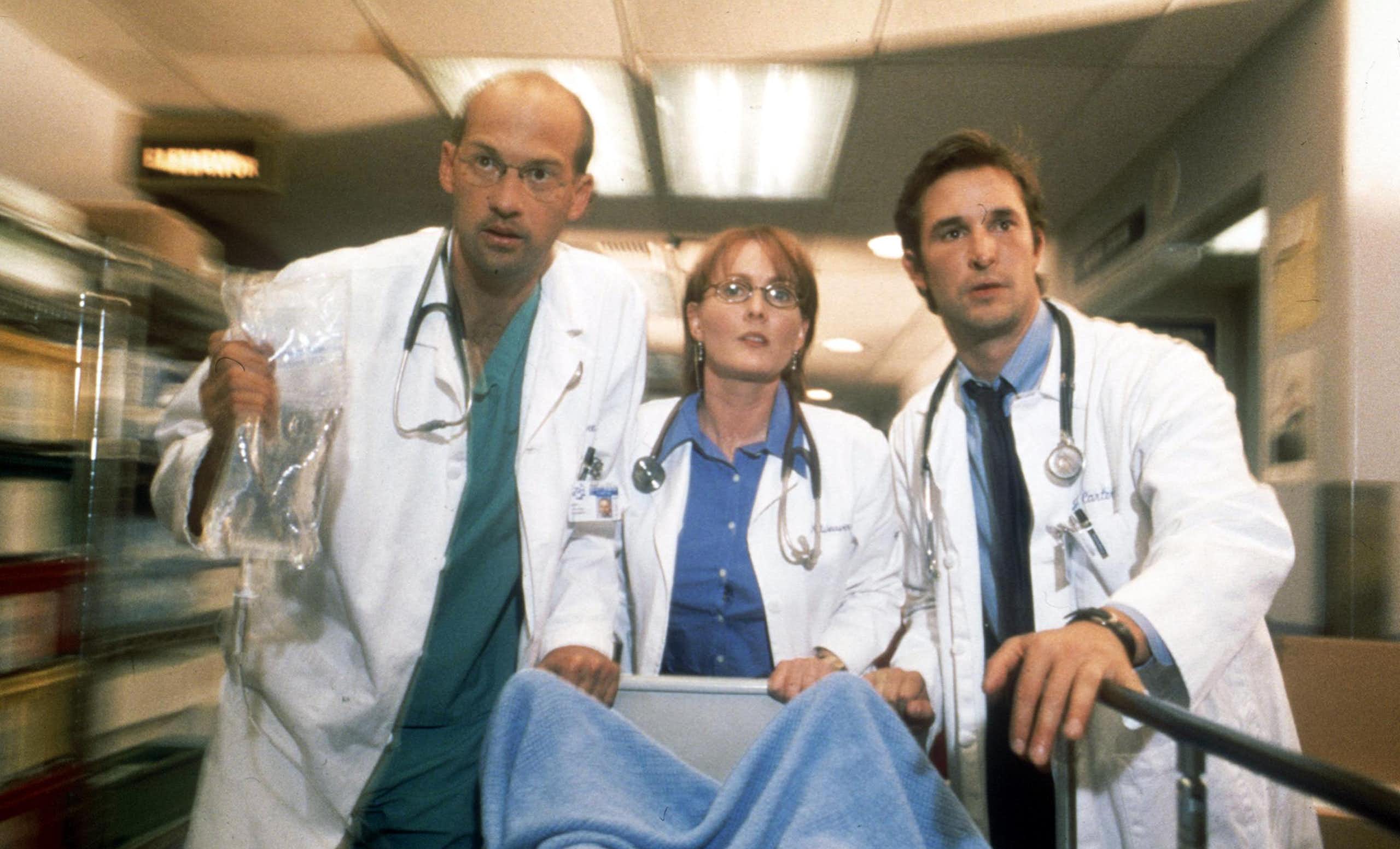 Cast members Anthony Edwards, Laura Innes and Noah Wyle act in a 2001 episode of NBC's prime-time drama series "ER."