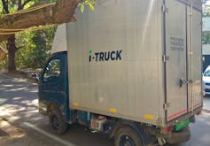 An electric delivery van on a street in India