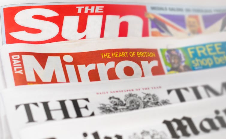Front pages of a stack of tabloids, including the Sun