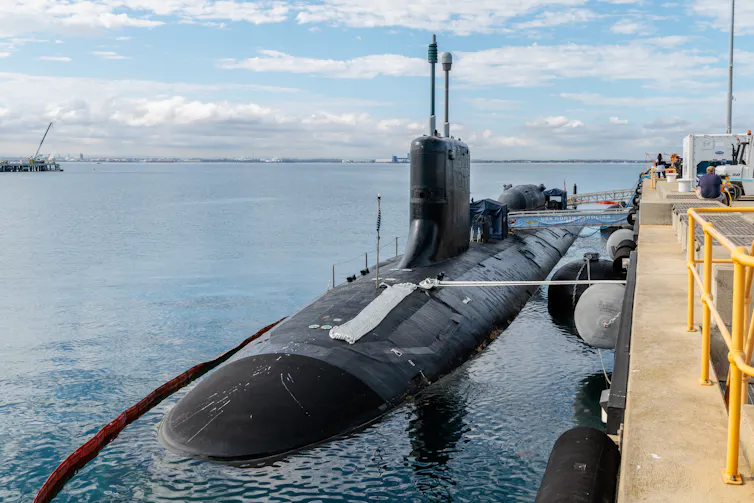 A nuclear-powered attack submarine in the water.