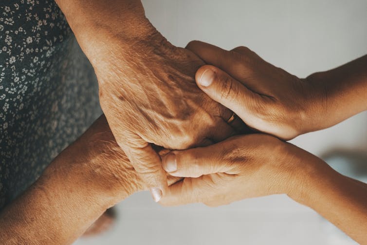 Young hands holding old hands