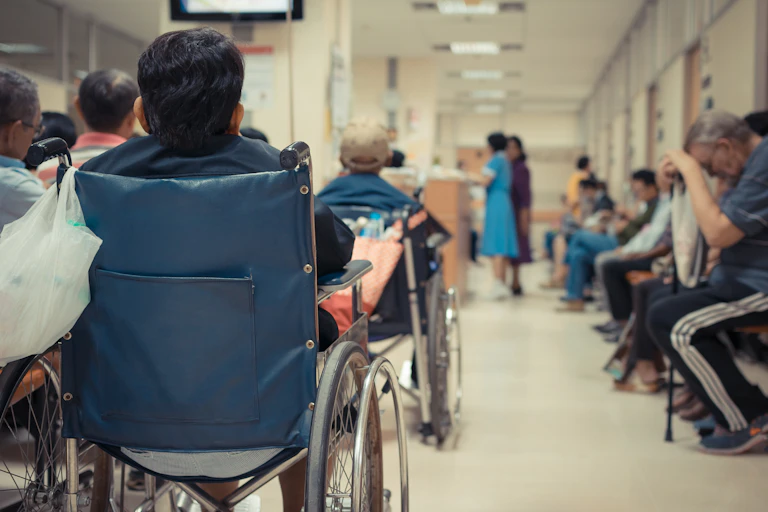 Patients wait for care in a hospital waiting room.