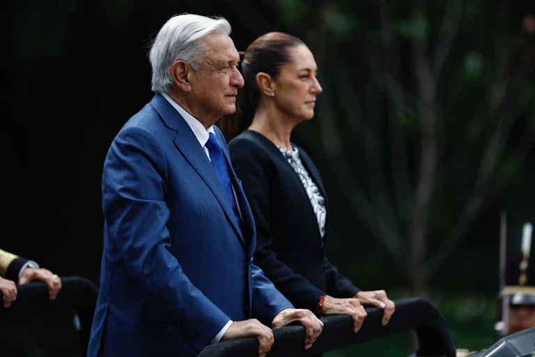 Mexico's president, Andrés Manuel López Obrador, standing beside his successor, Claudia Sheinbaum Pardo.