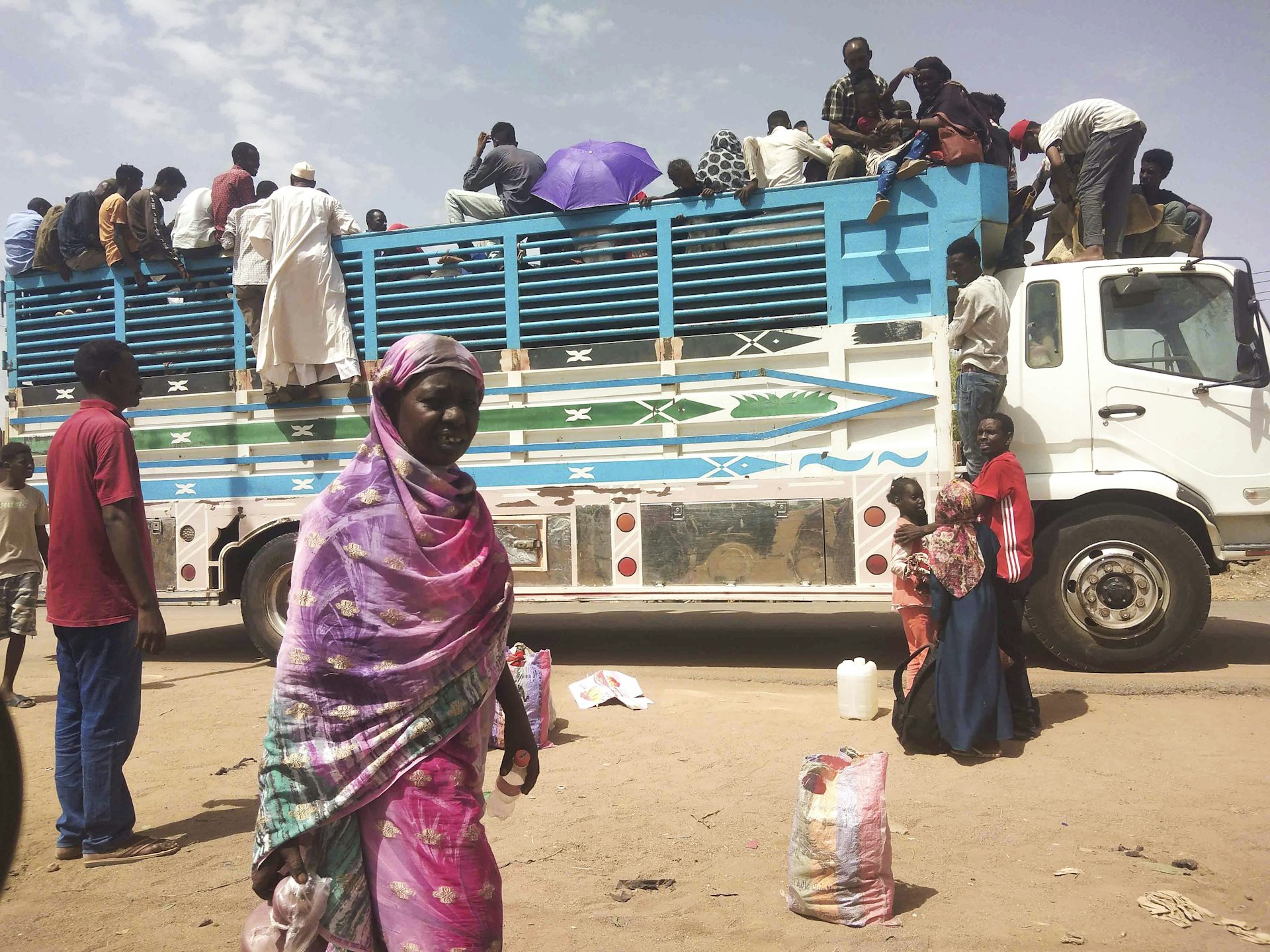 Sudanese refugees on a truck.