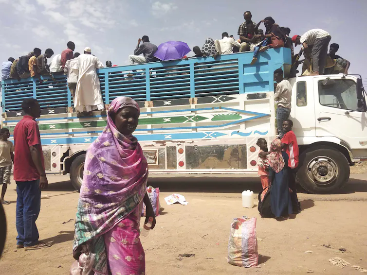 Sudanese refugees on a truck.