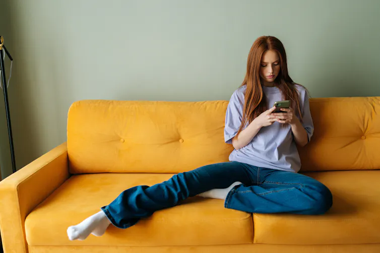 Young woman looking at smartphone.