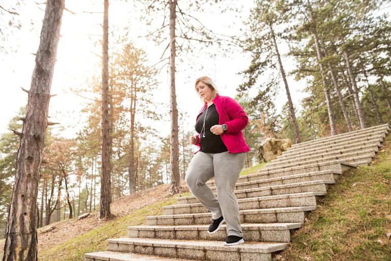 Woman jogs down stairs