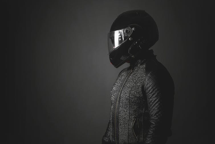 Man in a motorbike helmet