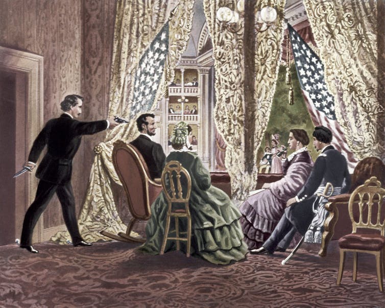 A drawing shows a man wearing a black suit holding a gun up against the back of a man's head while he is seated next to two women and a man in formal clothing.