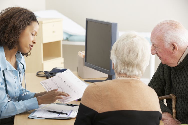 An older couple talks to their GP