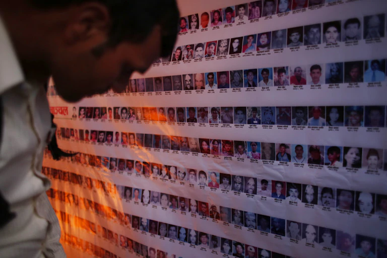 Man looks at victims' memorial.