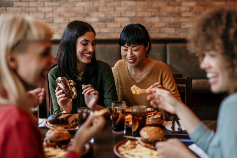 Friends eat dinner out