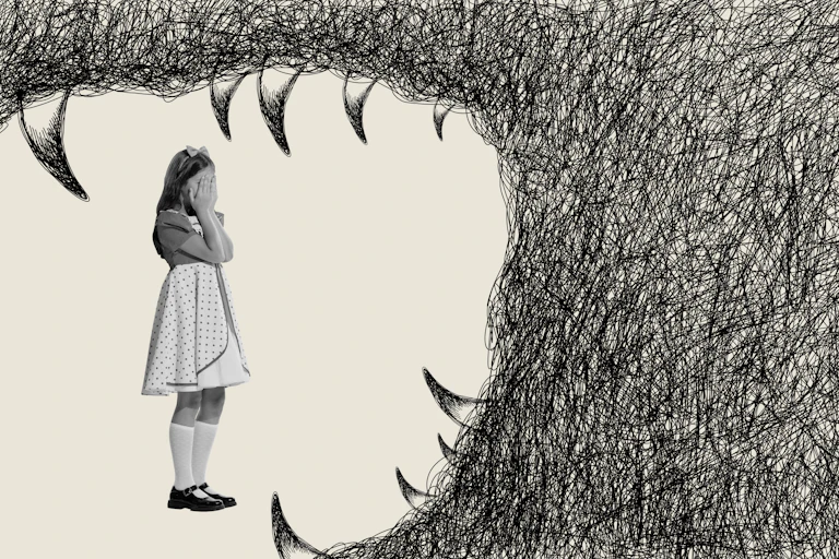 Little girl covering her eyes as a hand-drawn monster opens its jaws around her