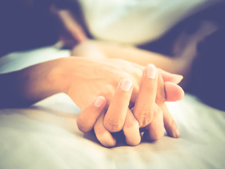 Close up of two entwined hands