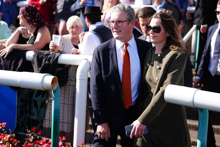 Keir and Victoria Sarmer at a racecourse.