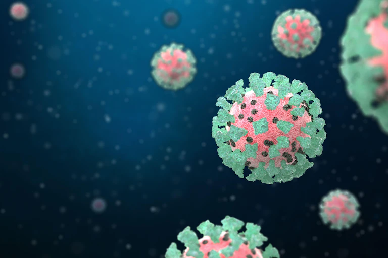 An artist's impression of the COVID virus, with the spike proteins in green