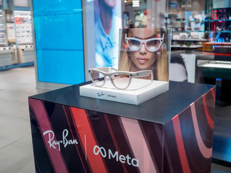 A pair of Ray-Ban Meta smart glasses sitting on display