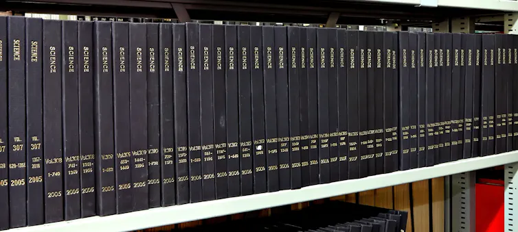 Old issues of Science journal lined up on library shelf.