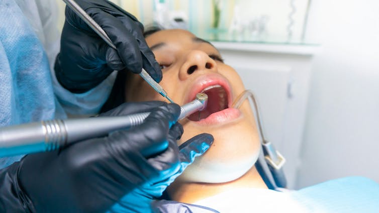 Dentist works on patient