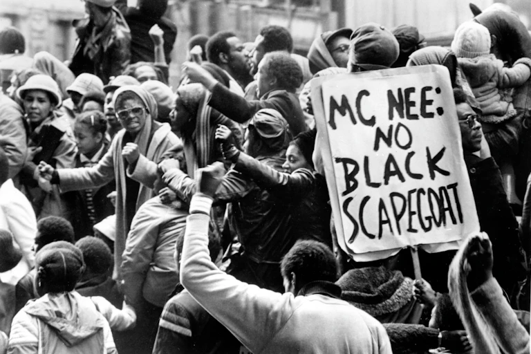 A group of black people protesting against the police in London 1981.