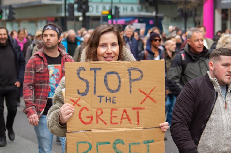 Protestor holding placard on march