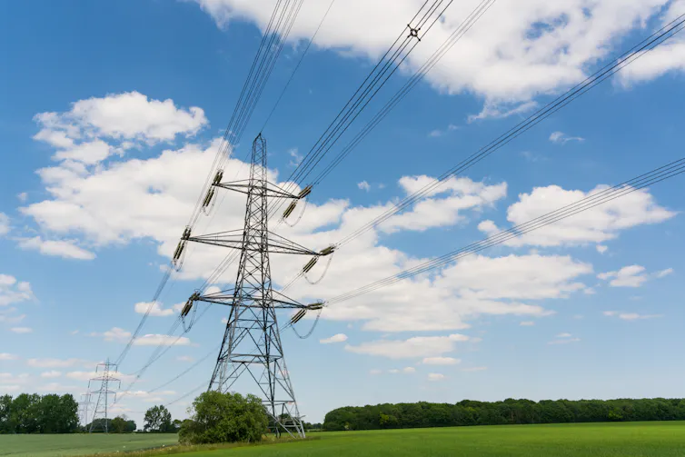 Electricity pylons in a field.