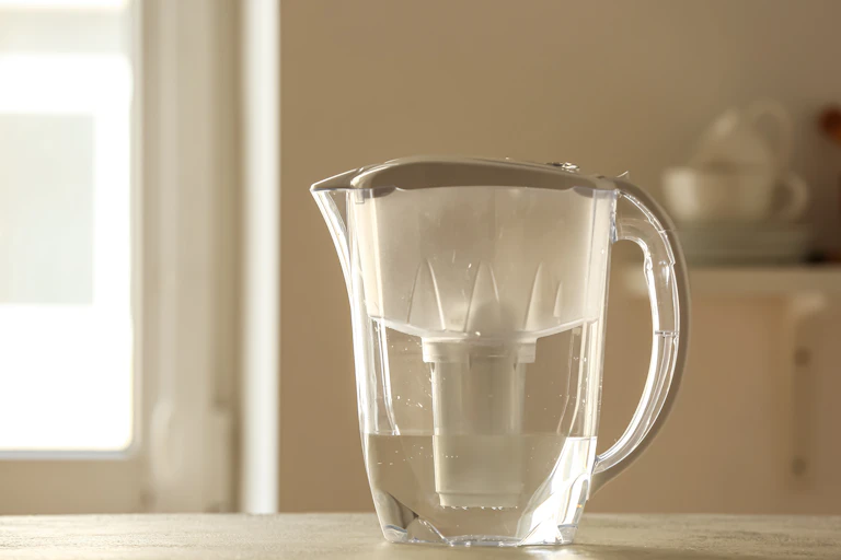 A water pitcher on a counter