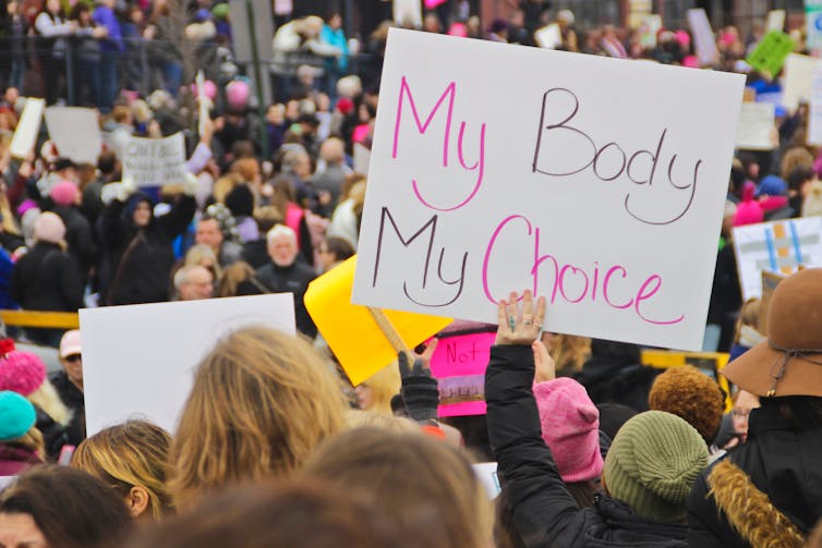 My body my choice sign at large protest gathering