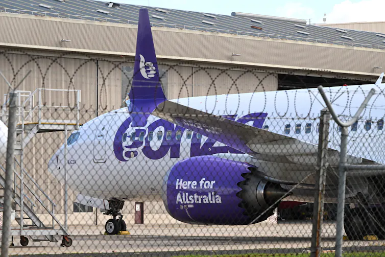 A plane sitting on a tarmac