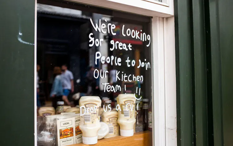job advert on the window of a cafe